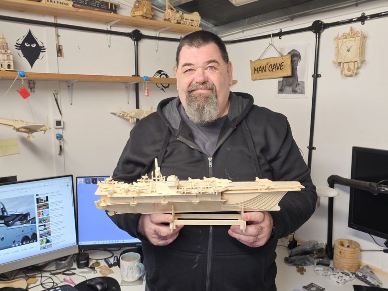 Blind veteran Gary showing his craft project