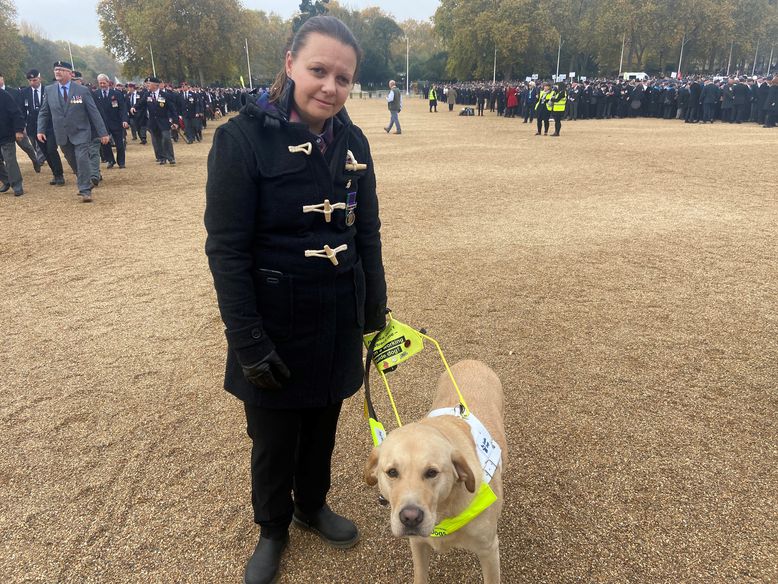 Blind veteran Kelly and guide dog at Remembrance